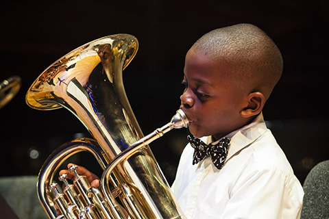 Donna E. Shalala mentee playing an instrument